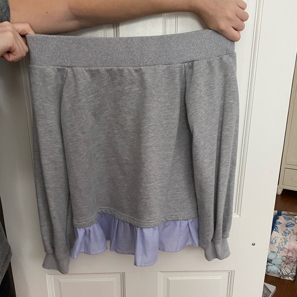 grey off the shoulder sweater with blue ruffle